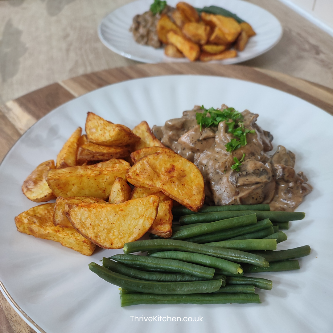 Creamy garlic chicken, Baked potato wedges and Green beans